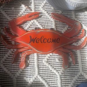 Distressed reddish orangey crab welcome sign!